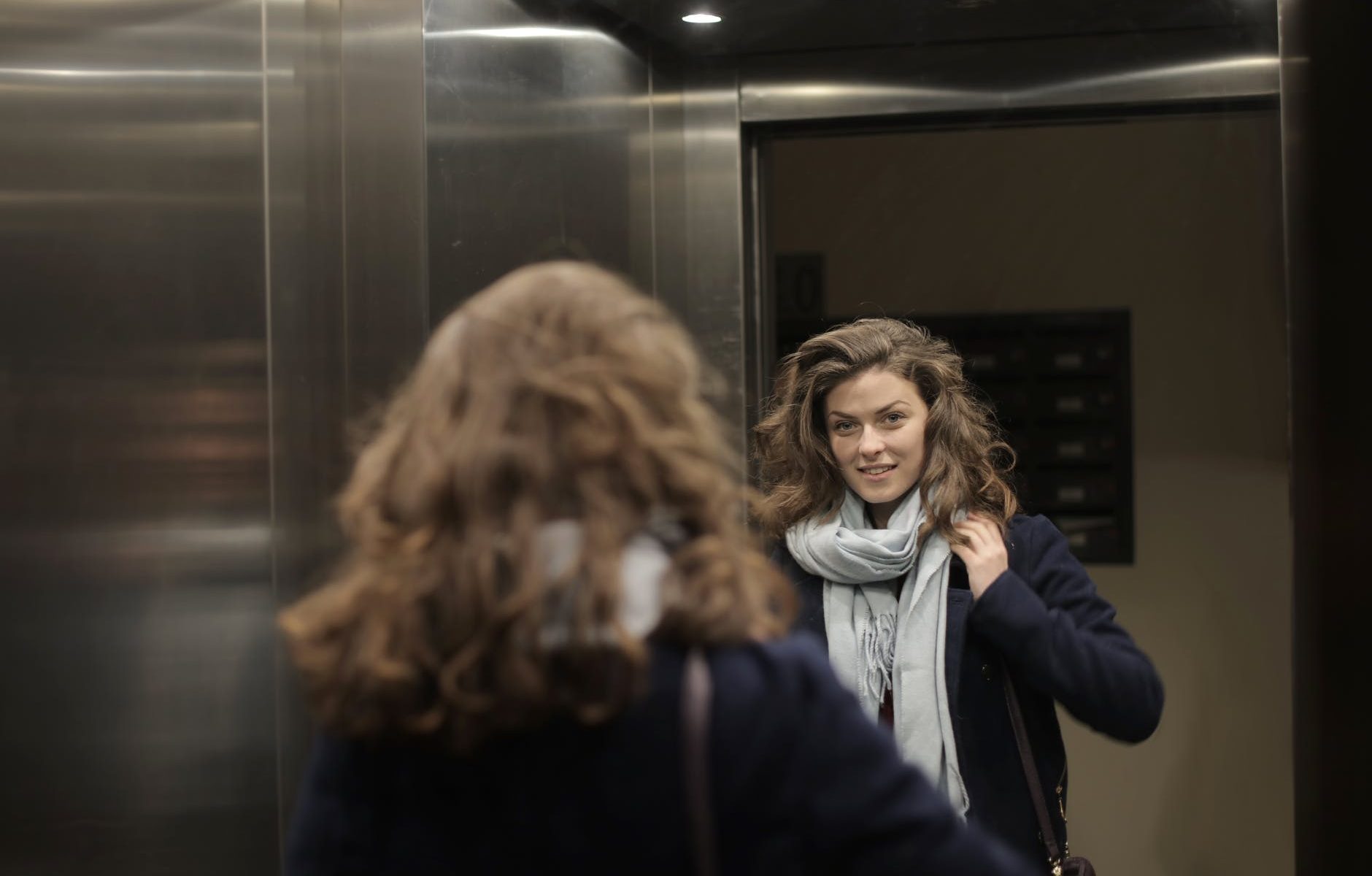 woman in blue jacket smiling
